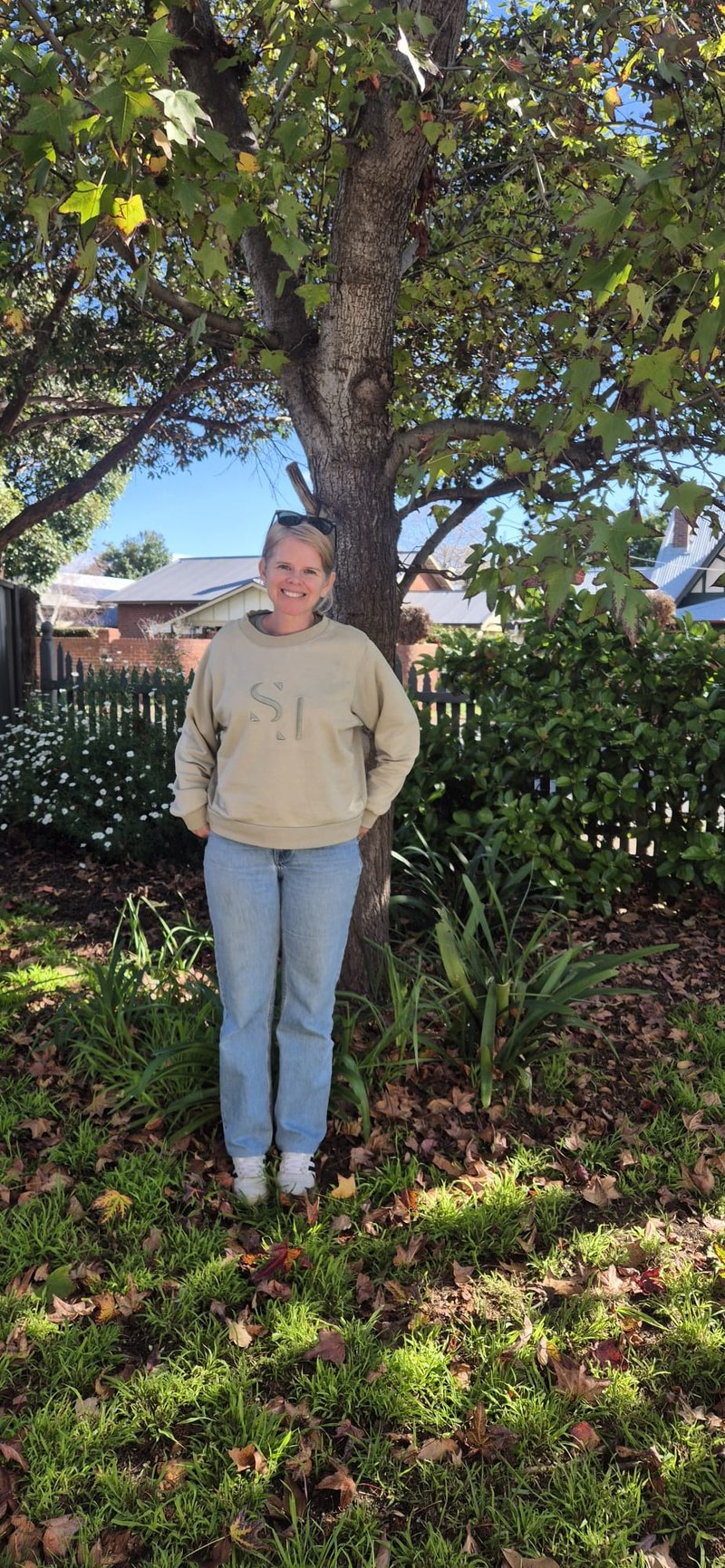 Clair, co-founder of Unleased, standing in a garden